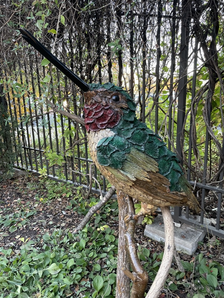 Hummingbird (3-4 feet tall) made of natural materials.