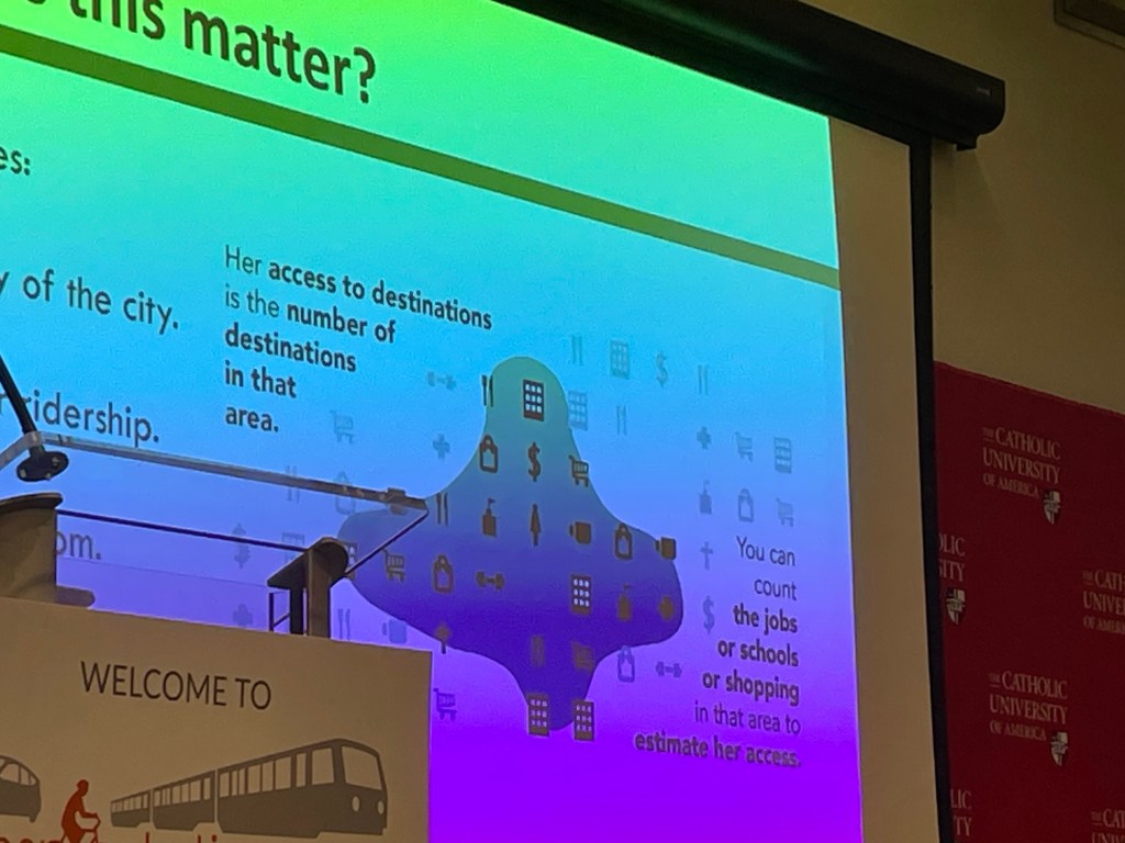 A PowerPoint slide showing icons (e.g., dollar sign, dumbbell, shopping cart, buildings) with a lower-case t-shaped blob over some of the icons. In the top left corner, the slide reads "Her access to destinations is the number of destinations in that area." In the bottom right corner, the slide reads "You can count the jobs or schools or shopping in that area to estimate her access."